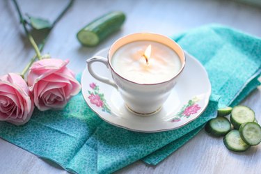 lit teacup candle