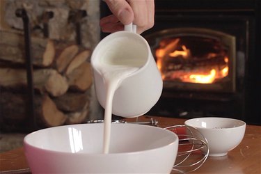 Cream is poured into a bowl.