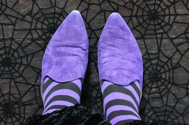 purple witch shoes and striped tights