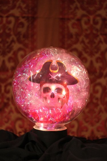 finished crystal ball glowing with skeleton head inside