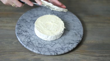 slicing top off brie