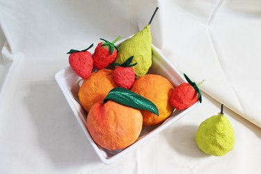 Finished papier-mâché fruits