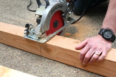 Using a skill saw to cut lumber