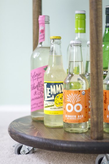 Add liquor and soda bottles to the bottom of your bar cart.