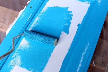 apply your paint color with roller brush | How to Paint Oak Bathroom Cabinets