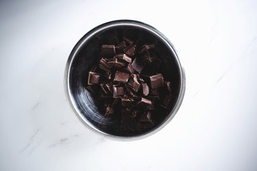 Chopped dark chocolate set aside in a bowl.