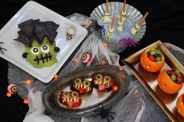 Four healthy Halloween snacks: Frankenstein guacamole, witch's broom cheese sticks, apple monsters, jack o'lantern fruit cups