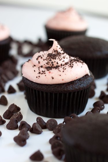 Close up of chocolate cupcake with strawberry frosting