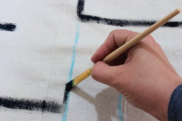paint chalk paintbrush drop cloth hand
