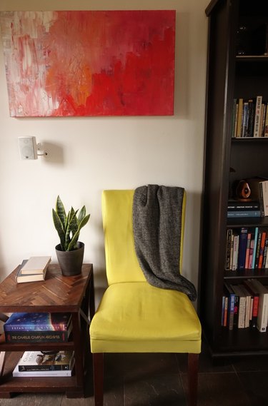 Fabric chair painted with chalk paint in living room.