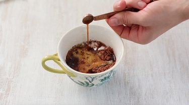 adding wet ingredients to mug