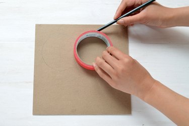Trace the tape to make a second circle