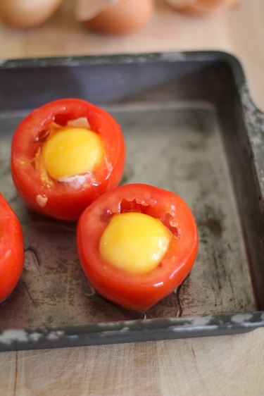 Tomatoes with raw eggs inside.