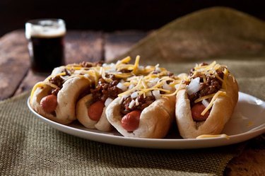 Plump and meaty chili dogs served with a stout.