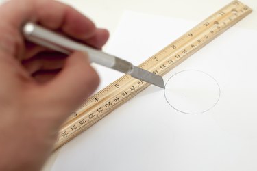 Cut a paper circle the size of the cylinder opening