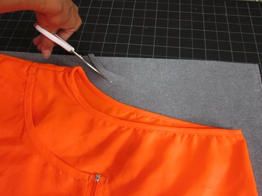 Cut a vest shapeout of brown vinyl