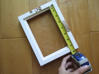 Measure the longest side of the back of the frame.