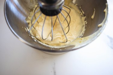Whisk the egg yolks and sugar until they are light in color and thick in texture.