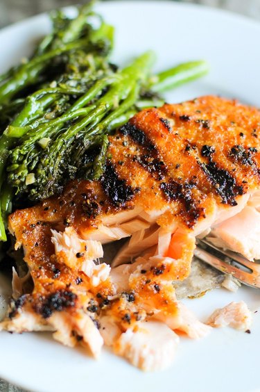 Grilled salmon on a plate with broccolini