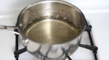 Simple syrup simmering in pan