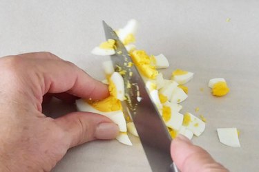 chopping the egg