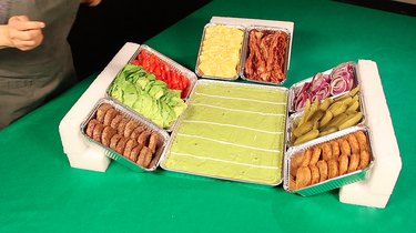 filling trays with burgers and toppings