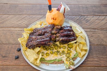 Seven-layer dip covered in ribs.