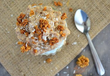 Coconut macaroon parfait topped with granola and coconut flakes.