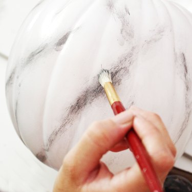 Add the finishing touches to your marbled pumpkin