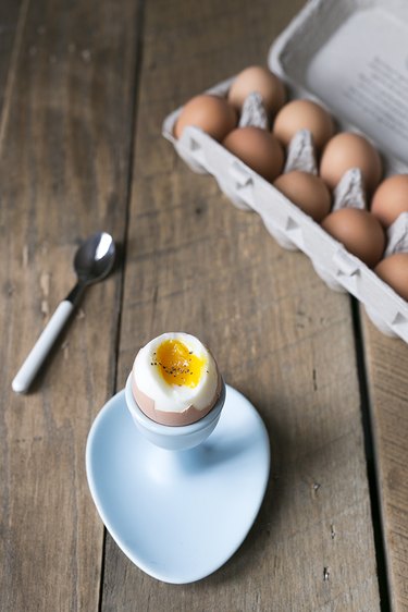 Soft boiled egg in light blue egg holder