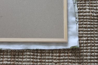 Layer the fabric, batting, and cork board