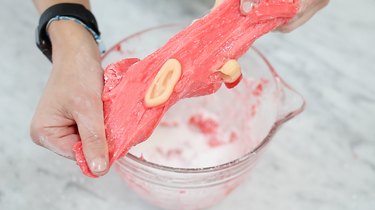 Stretching edible slime with gummy ear