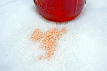 Red stain on white towel