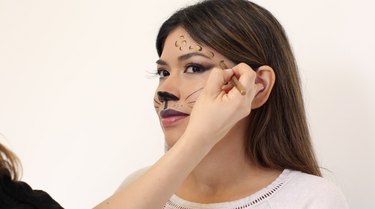 Fill in leopard spots with gold eyeliner