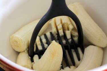 bananas with potato masher