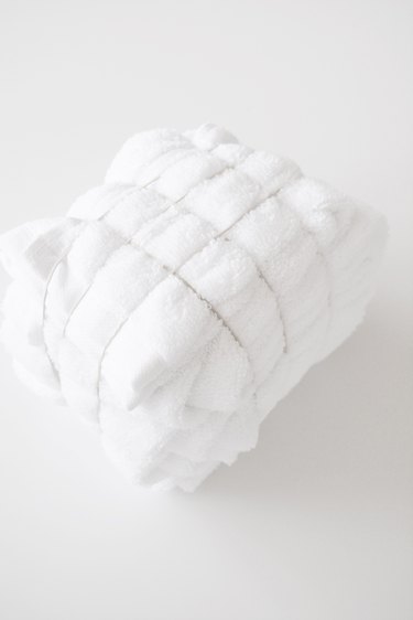 Wrap the towel in elastic bands.