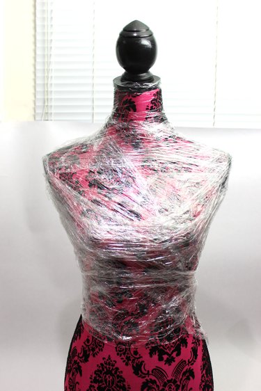 Plastic wrap forming the packing tape ghost torso on the dress form mannequin