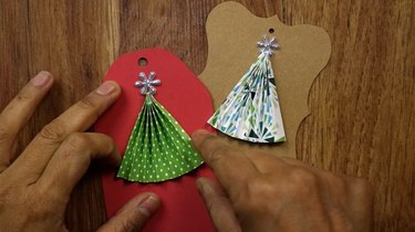 DIY Christmas tree gift tags with scrapbook paper and stickers.
