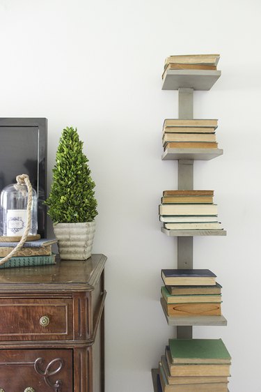 vertical bookshelf alongside a dresser