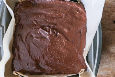 Baking dish with brownie batter in it