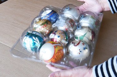 Christmas ornaments in recycled fruit packaging.