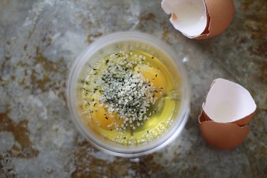 Eggs and hemp seeds in a blender canister.