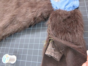 Sewing fur to itself.
