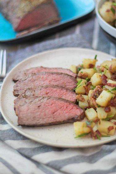 Tri-tip on a plate with potato salad