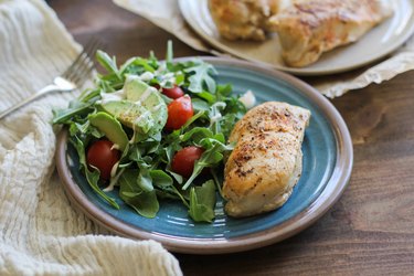 Chicken on  a plate with salad