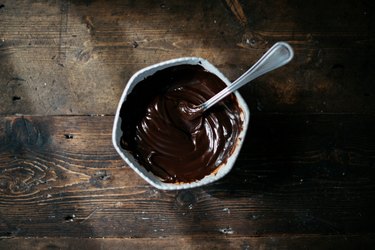 Stir the chocolate and cream together until it forms a very glossy ganache!