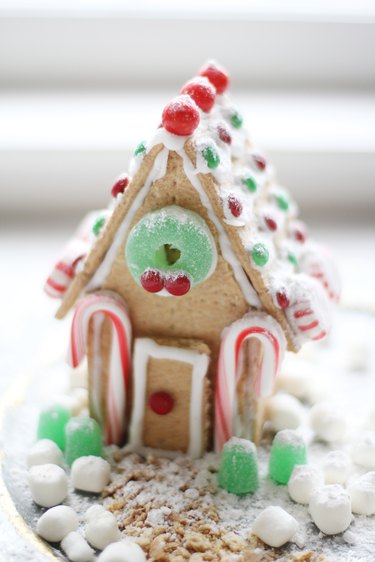 Powdered sugar dusted on gingerbread house