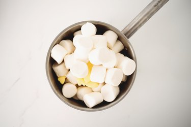 Marshmallows and butter placed in a large saucepan.