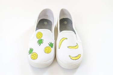 Canvas shoes with painted pineapples and bananas