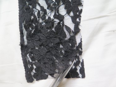 Using the cut lace as an outline to cut three more pieces.